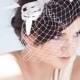 Bridal fascinator with french veil and feathers, bridal millinery hairpiece