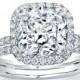 Ladies 14kt white gold cushion halo engagement ring w/ 1.70 ct Cushion shape white sapphire center and 0.40 carats of G-VS2 quality diamonds