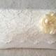ivory lace wedding clutch with flower and pearl center