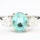 Paraiba tourmaline and diamond three stone trilogy engagement ring in 18 carat white gold vintage for her