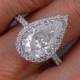 Stunning 3.68 ctw Pear Shape Diamond Engagement Ring with a 3.09 G Color/SI2 Clarity Enhanced Center Diamond