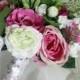 Maya- Wedding bouquet - white and dark, hot pink flowers.  Roses, rannunculas, lissianthus, tubberrose and maiden hair fern.