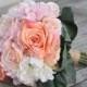 Blush pink hydrangea, coral roses and ivory peonies wedding bouquet.