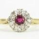 Vintage Ruby & Diamond Cluster Ring, Claw Set Ruby with Diamond Halo in 18 Carat Gold, Circa 1960s.