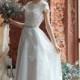 Lora / A-line wedding dress / Boned / Open back wedding dress / Covered shoulders / Short train