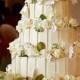 Four Tier White Chocolate Wedding Cake With White Roses.JPG