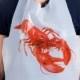 Pack of 12 disposable Adult size lobster bibs. Poly plastic design. Perfect for cookouts, lobster broils, crafwish, BBQ and events!