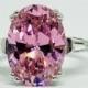 A Fancy Pink 5.9CT Oval Cut Russian Lab Diamond Solitaire Ring