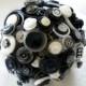 Black and white button bouquet with a white lace and light grey voile collar