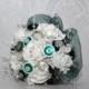 White foam rose bouquet with green button flowers and a deep green frilled edge