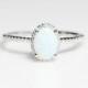 Sterling Silver Oval White Opal And CZ Halo Ring