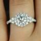 Rosados Box Amora 7mm 14kt White Gold Round F1- Moissanite And Diamonds Halo Heart Shape Detail Engagement Ring