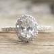 Oval White Sapphire & Diamond Halo Engagement Ring In 14K White Gold