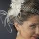 Feather Fascinator with Crystal Detailing & Russian Birdcage Blusher Veil