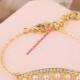 Juicy Couture Gold-Tone Diamond Pearl Crown Charm Hook Bracelet