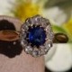 Oval sapphire daisy ring entourage rose cut diamonds in 18k rose gold and silver