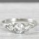 White sapphire and diamond engagement ring handmade in 14 carat gold art deco inspired