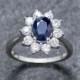Beautiful tanzanite flower design ring with diamonds and 925 sterling silver quality. Wedding/Engagement ring.