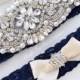 Luxurious crystal, pearl, rhinestone wedding garter set on navy blue lace with GRIP