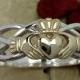 Claddagh ring, ladies solid 10K yellow gold claddagh on a silver celtic rope band.