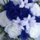 Royal blue round bouquet roses blue and white. Wedding bouquet.