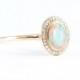 Opal and diamond halo engagement ring handmade in 14 carat rose/white/yellow gold