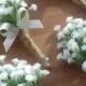 4 x Artificial Gypsophilia (baby's breath)button holes with stems bound in rope and finished with a ivory satin bow