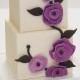 White Fondant Special Wedding Cake With Purple Flowers 