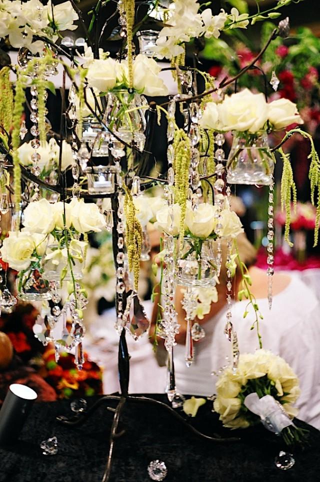 wedding photo - Candelabra of roses and hanging amaranthus