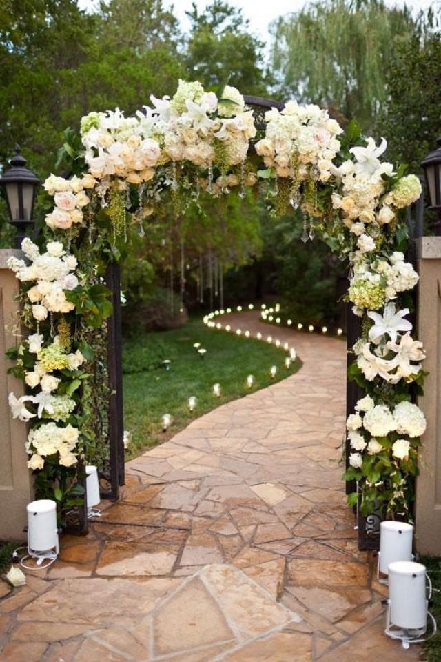 Wedding Ceremony Arch Decorated With White Flowers Wedding Ceremony Arch Decorated With White Flowers