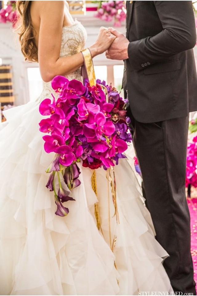 Purple orchids wedding bouquet with ribbon