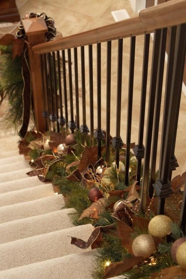 Holiday Decor Twist Garland At The Bottom Of Stair Railings