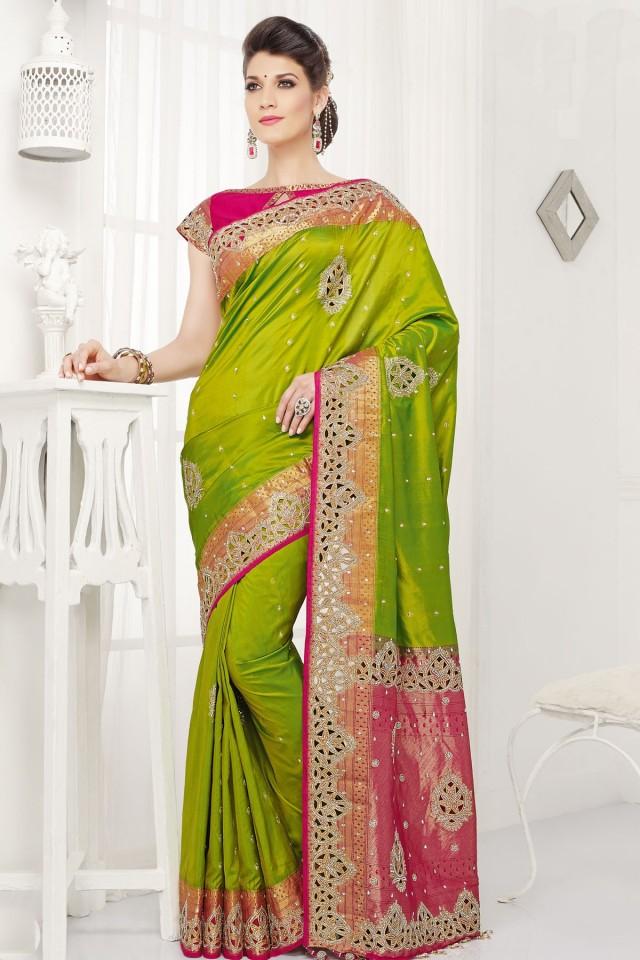 wedding photo - Green pure silk grand zari weaved saree with gold border