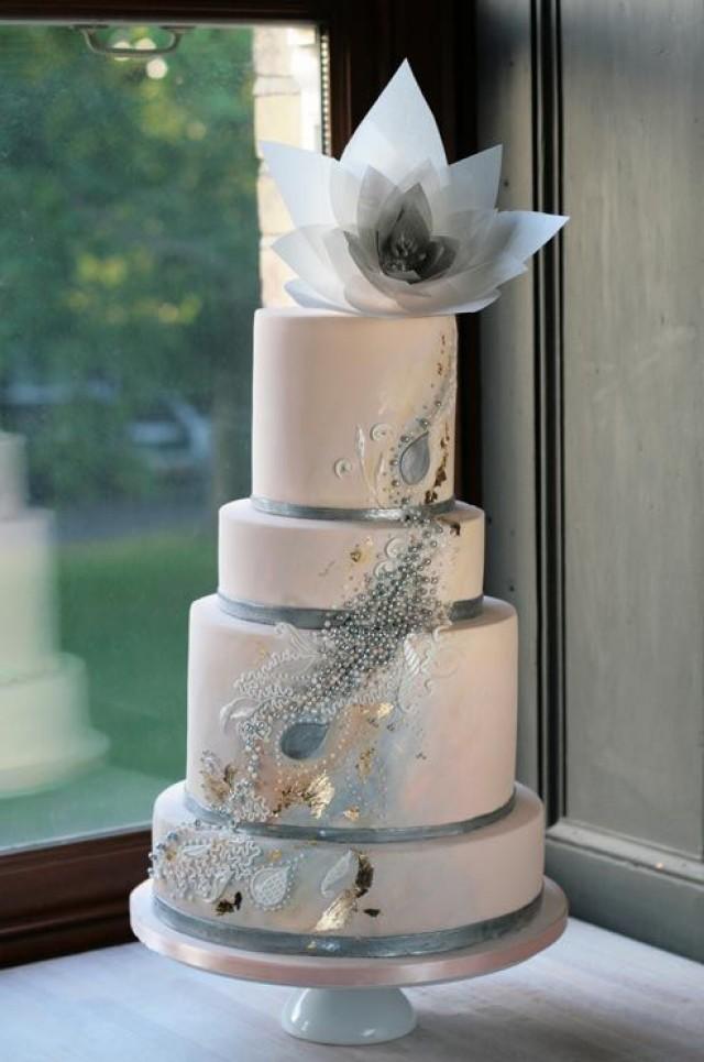 wedding photo - A Mix Of Pearls, Silver And Gold Gives A Sleek Beige Cake Artistic Flare.