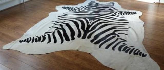 wedding photo - Zebra printed black and white patchwork cowhide rug