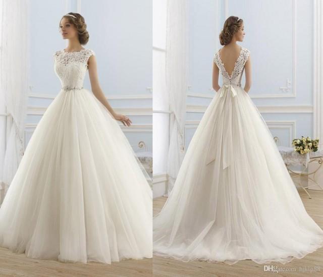 wedding photo - Perfect 2017 New Cap Sleeve Jewel Neck A-Line Wedding Dresses Illusion Tulle Appliques Lace Vintage Wedding Dress Beaded Sash Bridal Gowns Lace Luxury Illusion Online with $154.29/Piece on Hjklp88's Store 