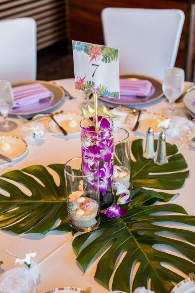 Tropical Centerpieces With Monstera Leaves / Http://www.himisspuff.com/green-tropical-leaves-wedding-ideas/7/ 