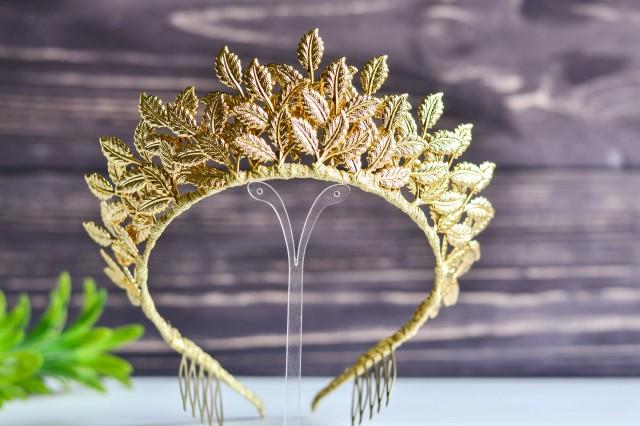 Delicate wedding tiara of golden leaves, tiara of bride from leaves