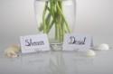 Use clip-on earrings as place card holders