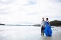 Grab your wellies and stroll along a beach with this bride and groom