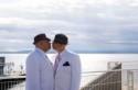 Two grooms in white elope to Olympic Sculpture Park