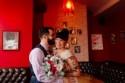 Tiny, gold, and floral: this "cheez-y" weekday wedding in a diner wins