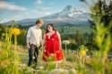 A spectacular literary wedding with a mountain backdrop and a killer red dress