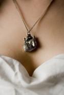 Someone needs to wear this goth-glam anatomical heart necklace at their wedding