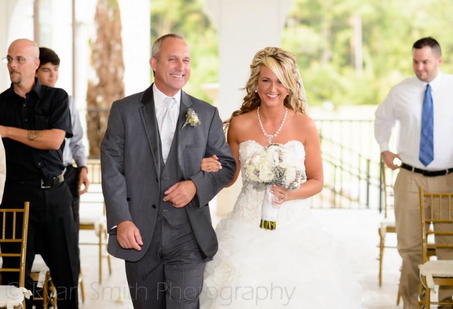 Wedding - Happy bride walking down isle with father