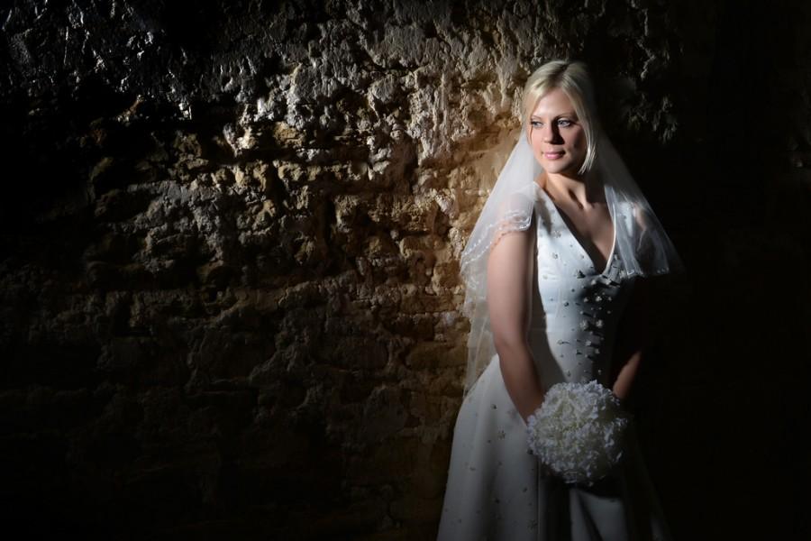 Wedding - Bride Against Barn Wall