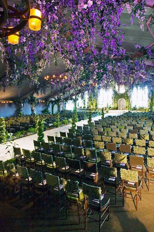 Wedding - The Aisle Is Flanked With Chairs Featuring Alternating Covers In Shades Of Green And Brown.