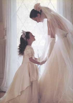 Wedding - Cute Bride And Flower Girl Pose. 