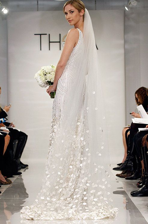 Hochzeit - A Chapel Length Wedding Veil From The Theia Fall 2014 Bridal Collection Is Laden With Countless White Flower Petals.