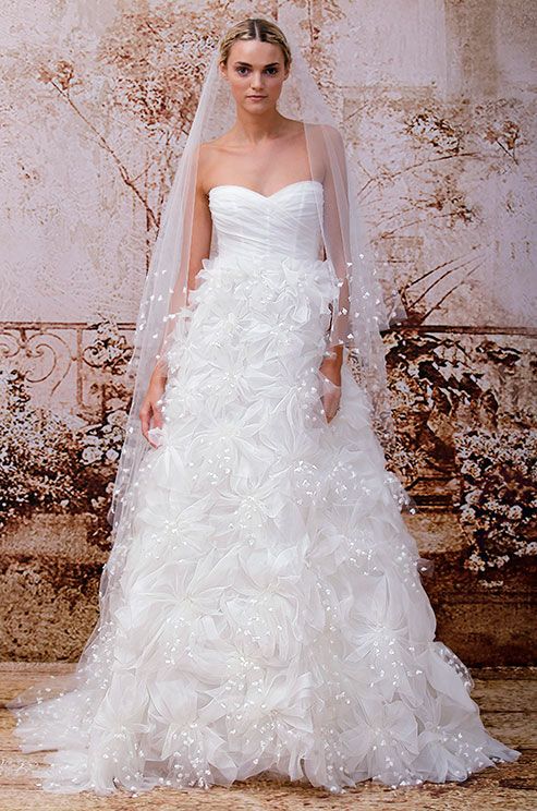 Wedding - A Floor Length Veil Is Dotted With White Embellishments From The Monique Lhuillier Fall 2014 Bridal Collection.